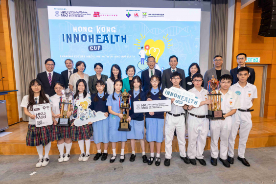 The winning teams: (first row, from right) King’s College (second runner-up), Kowloon True Light School (champion) and St Paul’s Convent School (first runner-up).
Officiating guests: (second row, from right fifth to seventh) Professor Chak-sing Lau, Vice-President & Pro-Vice-Chancellor (Health) of HKU and Dean of Medicine; Dr Choi Yuk-lin, Secretary for Education; Principal Lee Yi-ying, Chairman of the Hong Kong Subsidized Secondary Schools Council; along with the competition coaches and judges.
 